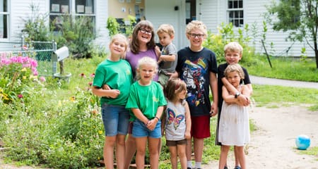 Family outside of their home