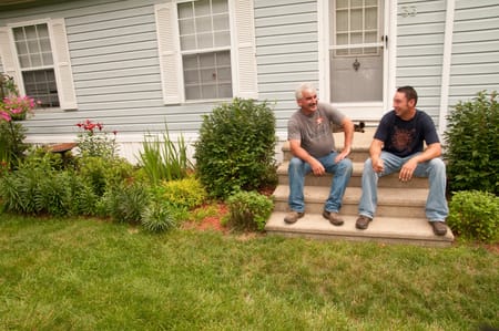 Family talking on their steps