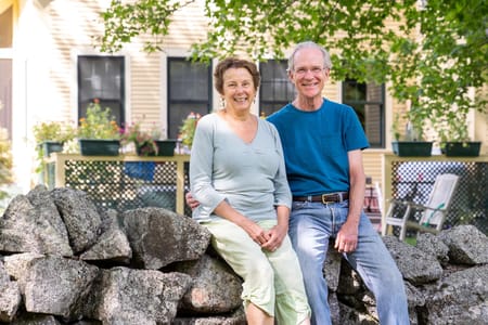 Middle ages couple outside of their home